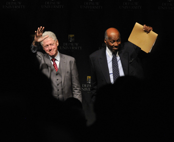 Bill Clinton and Vernon Jordan on stage waving to the crowd
